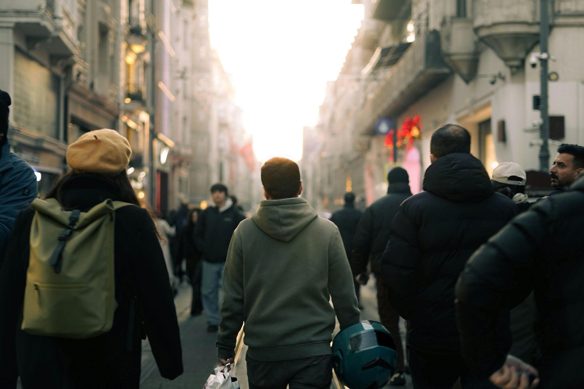 jeanneriedelmonth3gw People walk down a busy street, reflecting on what does it mean to have faith in daily life.